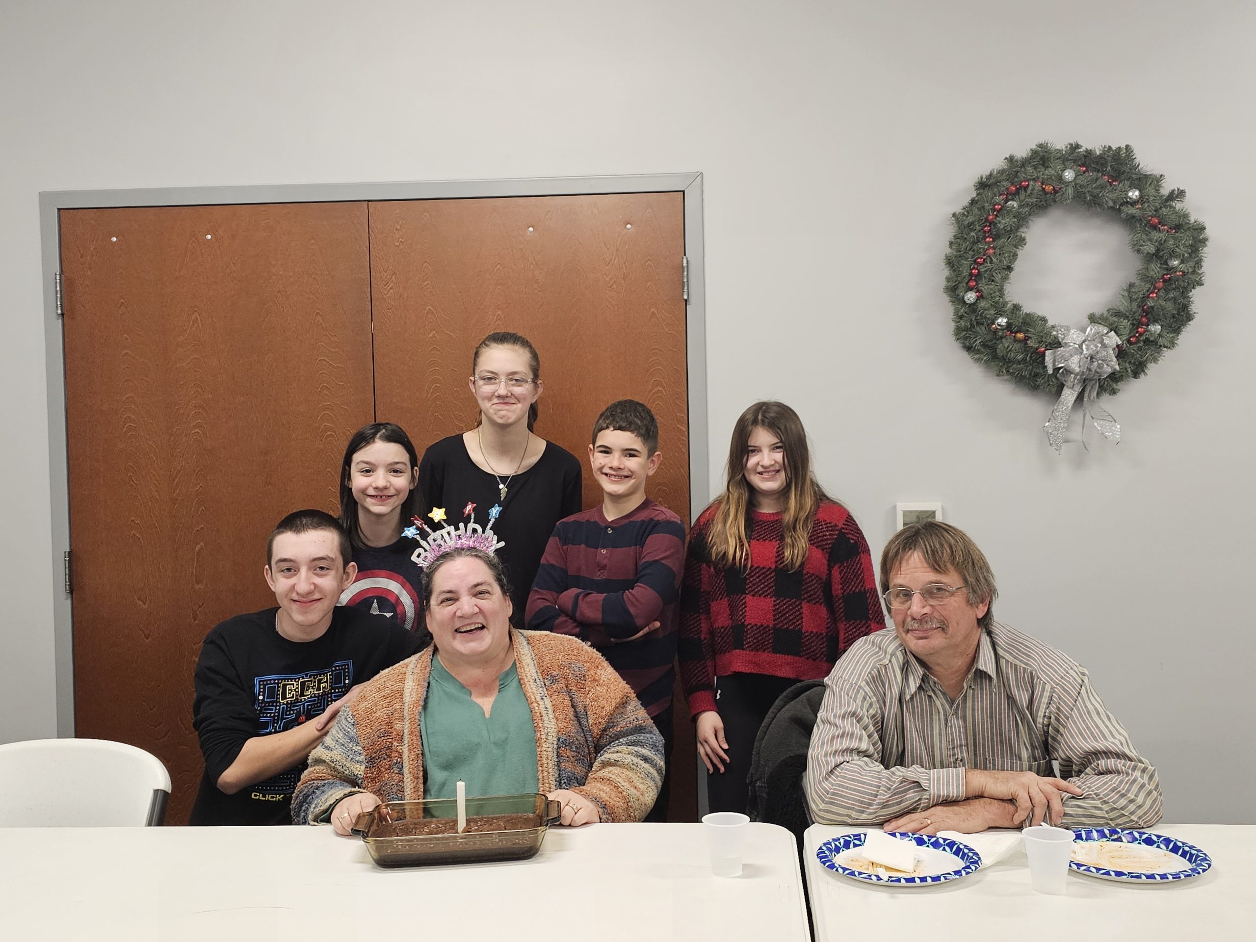 Youth Group celebrating a birthday with leaders.